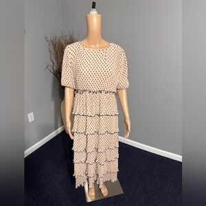 BEAUTIFUL  BRAND NEW RUFFLE DRESS. PEACH WITH BLACK DOTS.